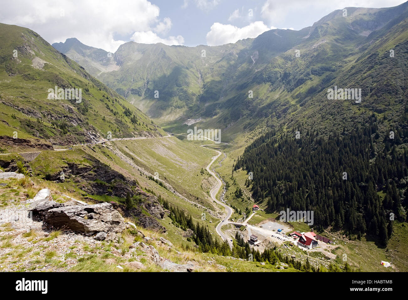 summer mountain landscape with winding highway road, Romania Stock Photo