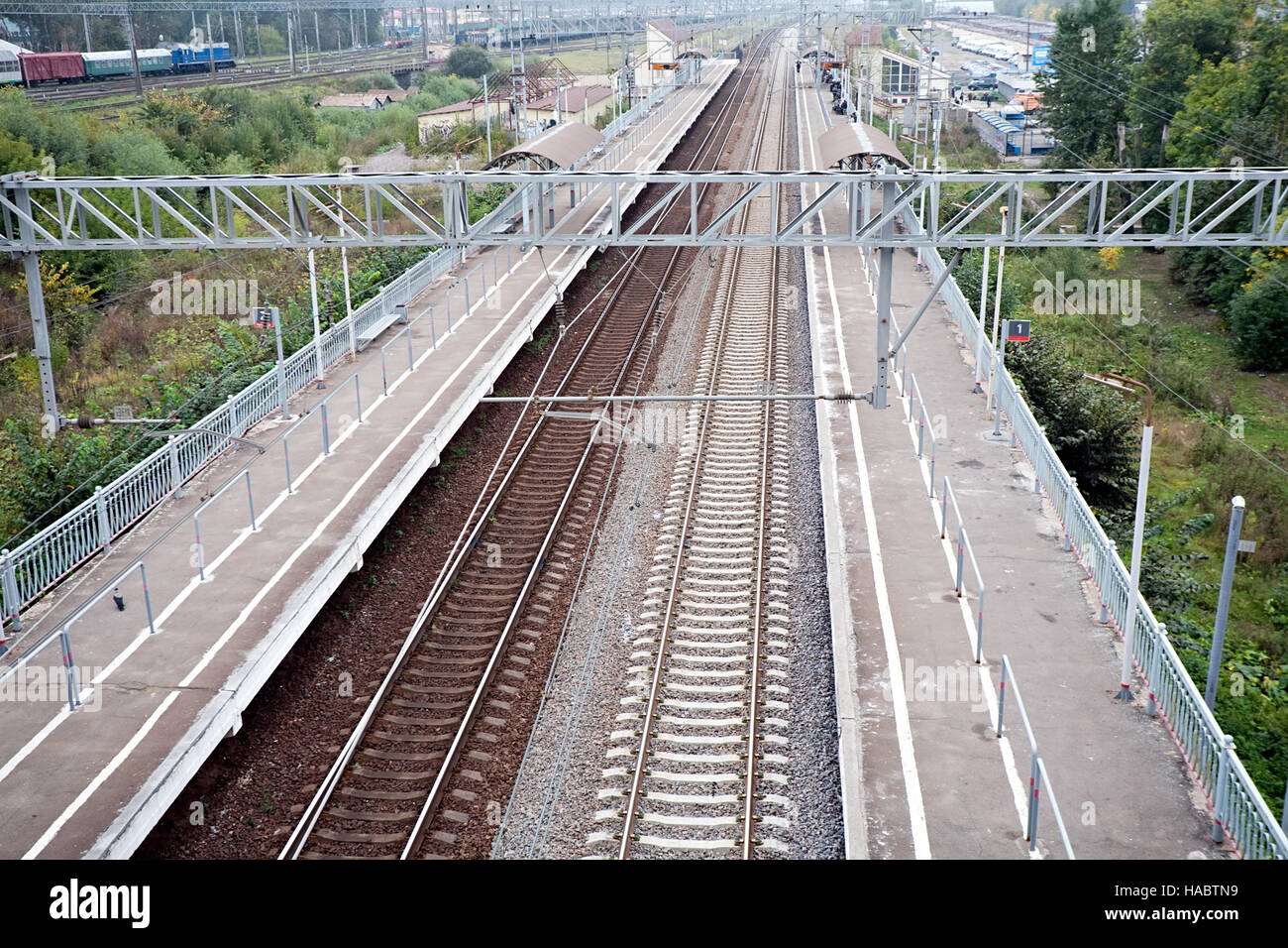 railway station platform and rails top perspective view Stock Photo