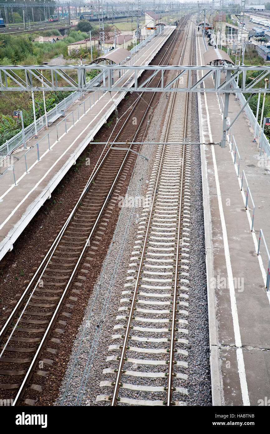 railway station platform and rails top perspective view Stock Photo