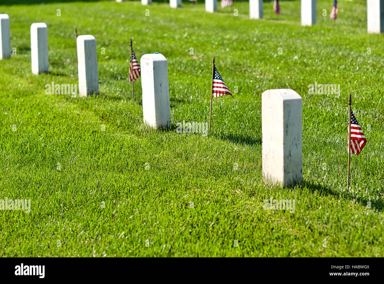 Fort Myer, Virginia, USA - May 1, 2015: American flags honor veterans buried at Arlington National Cemetery at Fort Myer near Washington, D.C. Stock Photo