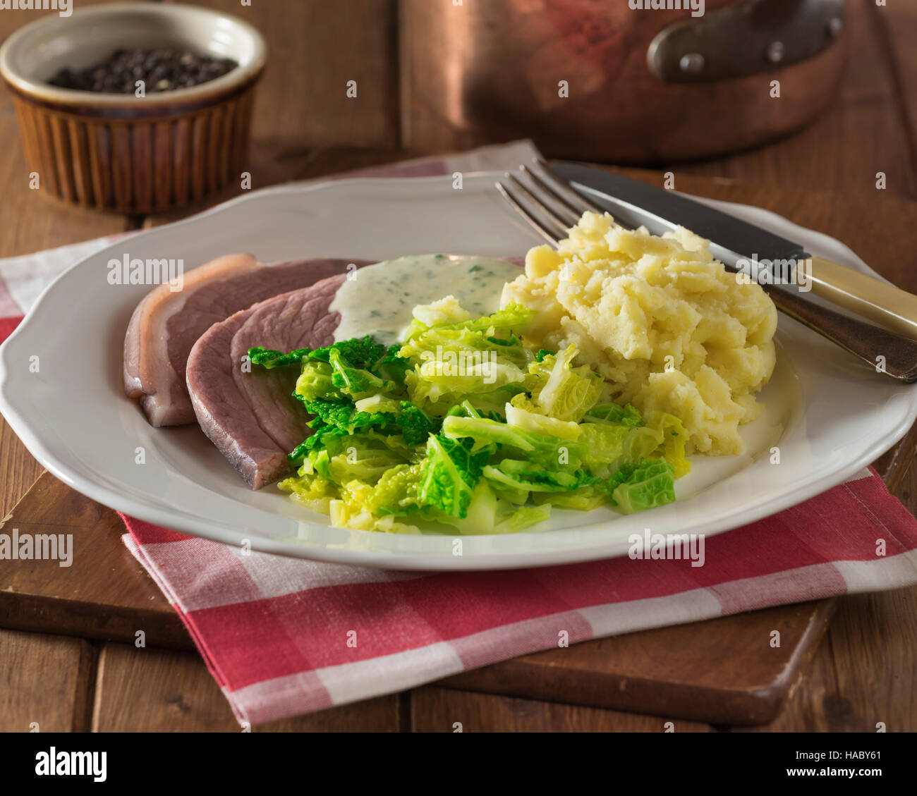 Irish bacon and cabbage with parsley sauce. Ireland Food Stock Photo