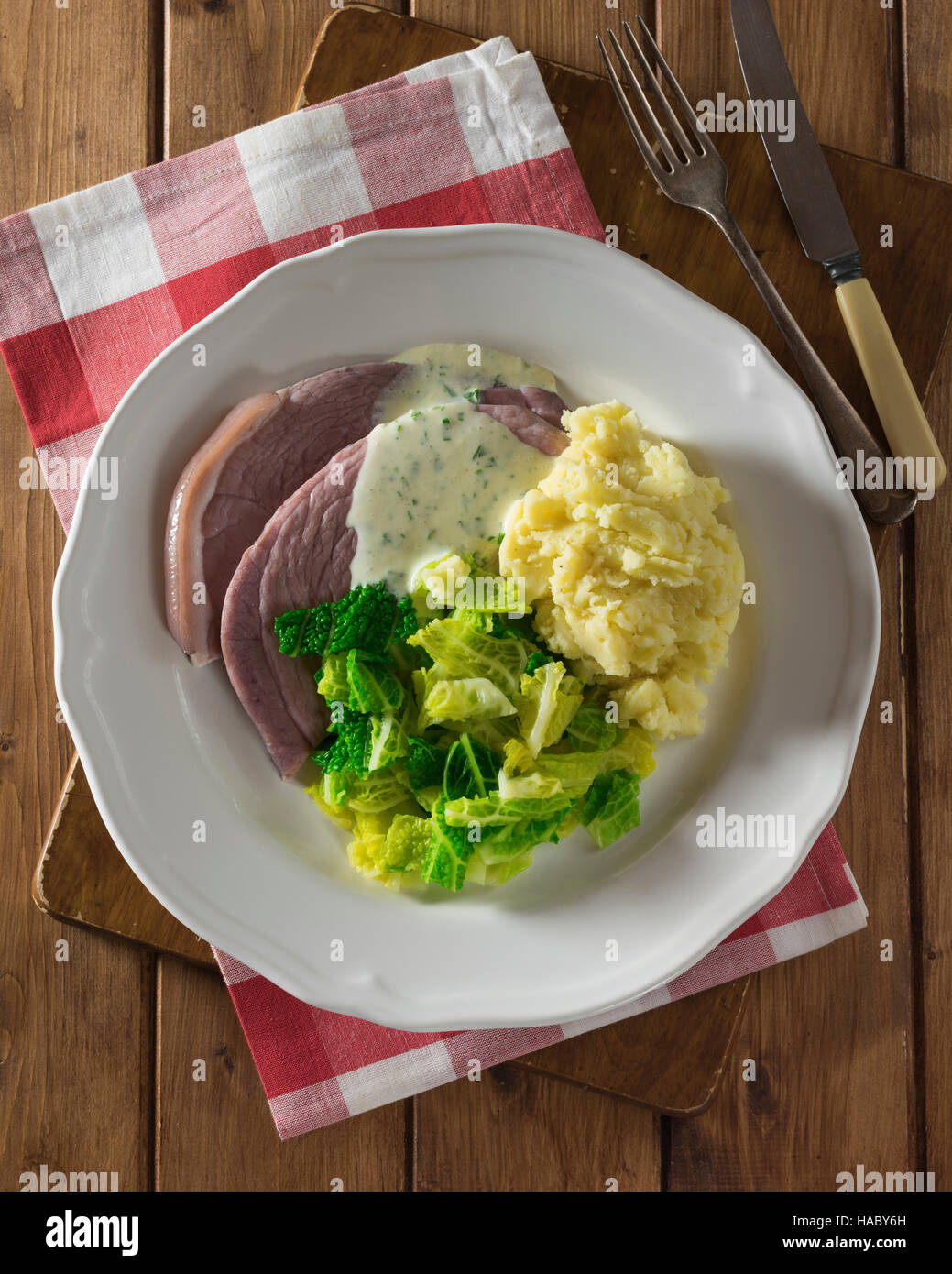 Irish bacon and cabbage with parsley sauce. Ireland Food Stock Photo