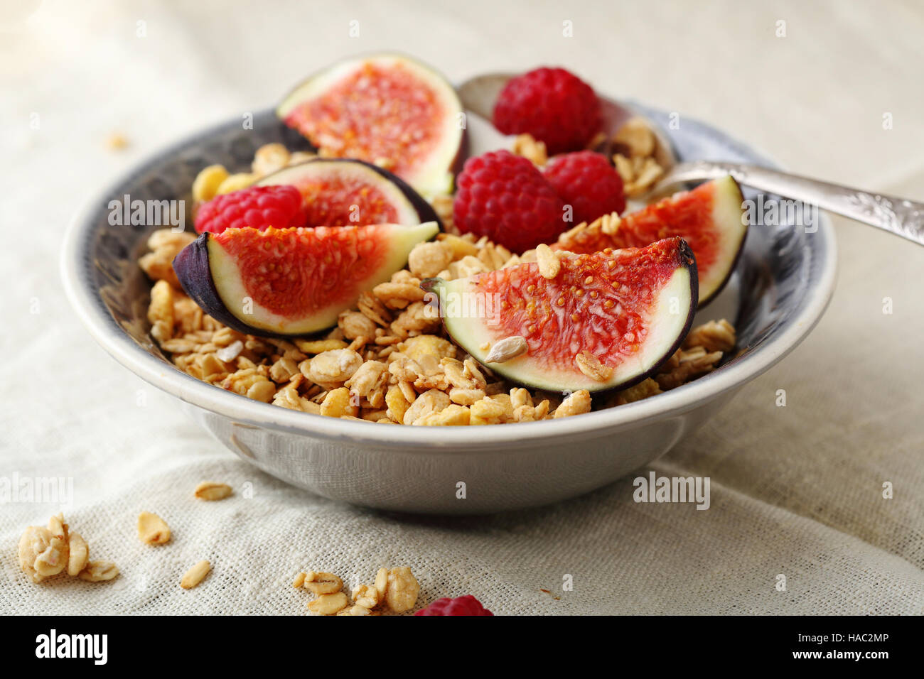Breakfast cereals with figs and berry, food closeup Stock Photo