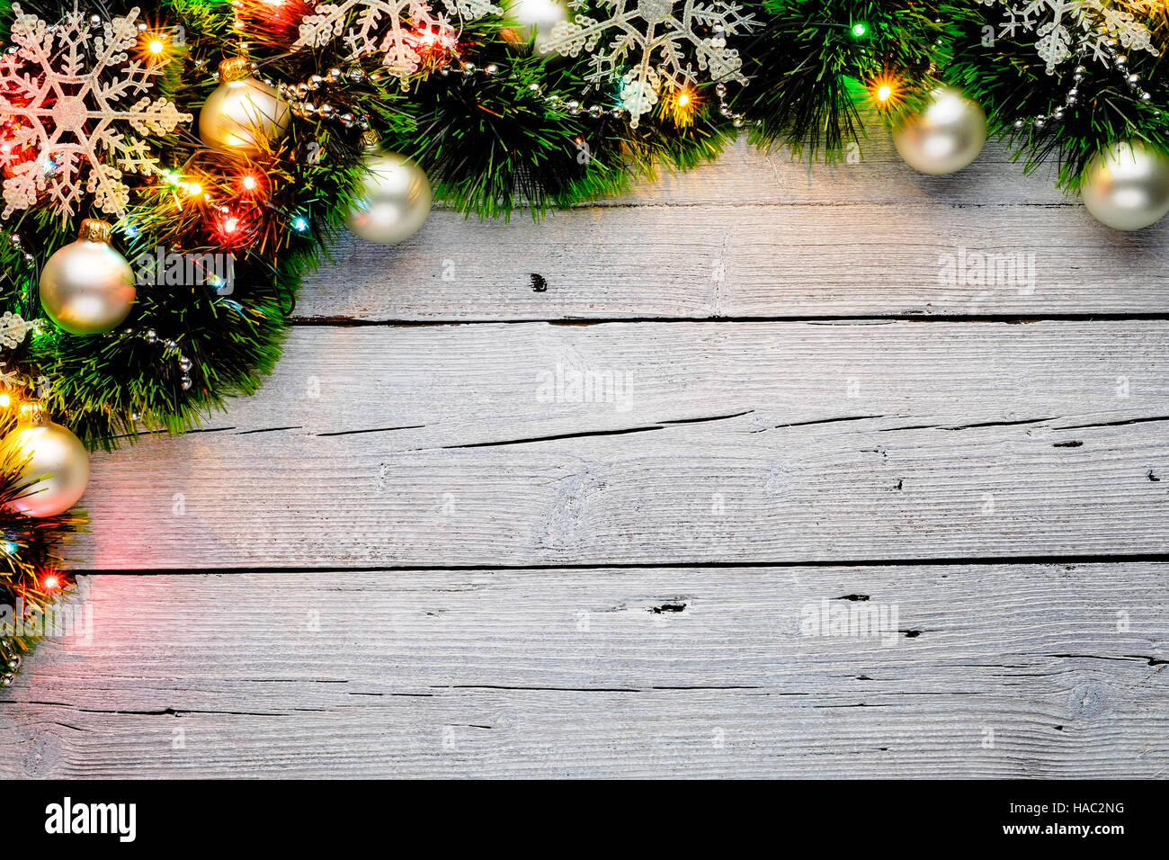 Christmas artificial fir tree branches with decorations on an white ...