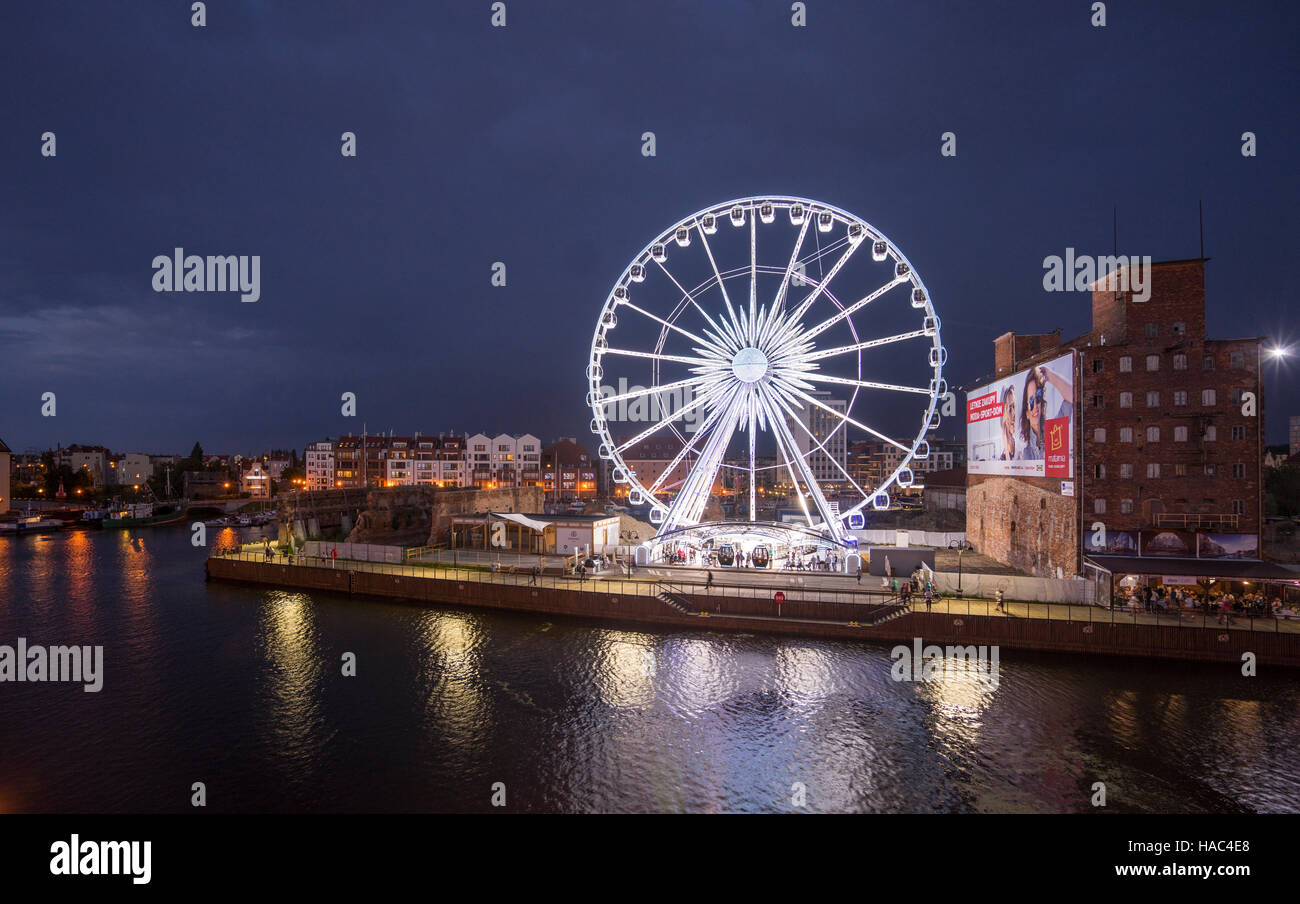 Poland, Pomerania, Gdansk (Danzig), night view of the Amber Sky Ferris Wheel on Granary Island (Speicherinsel/Wyspy Spichrzów) Stock Photo