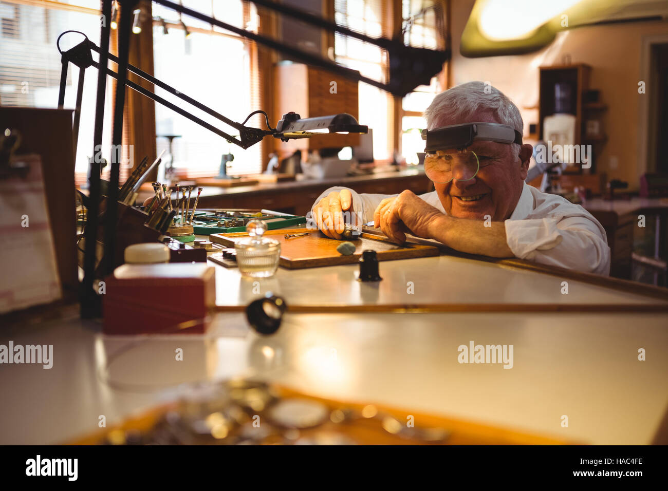 Horologist repairing a watch in the Stock Photo Alamy