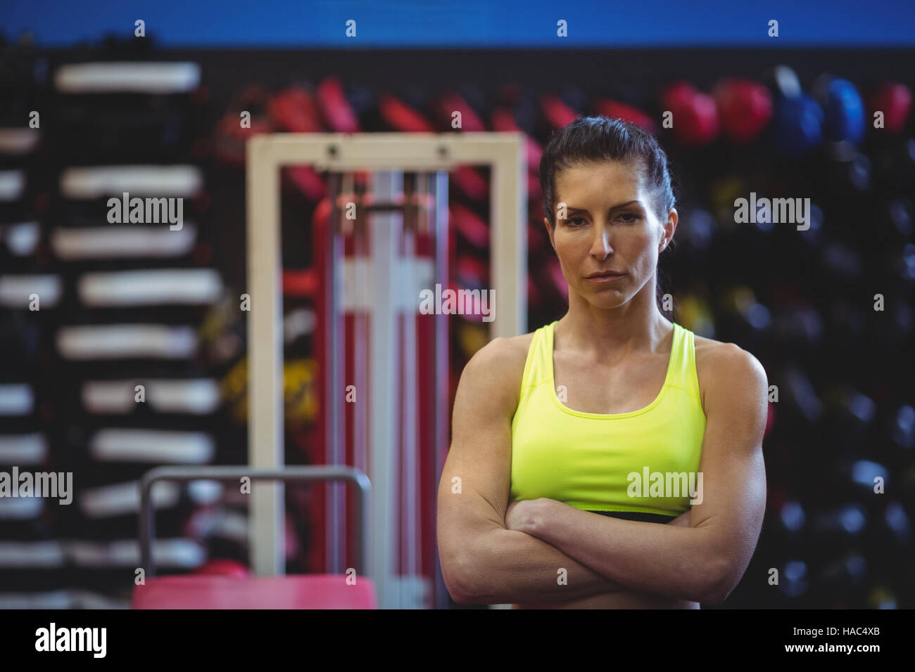Sportswoman standing with arms crossed Stock Photo - Alamy