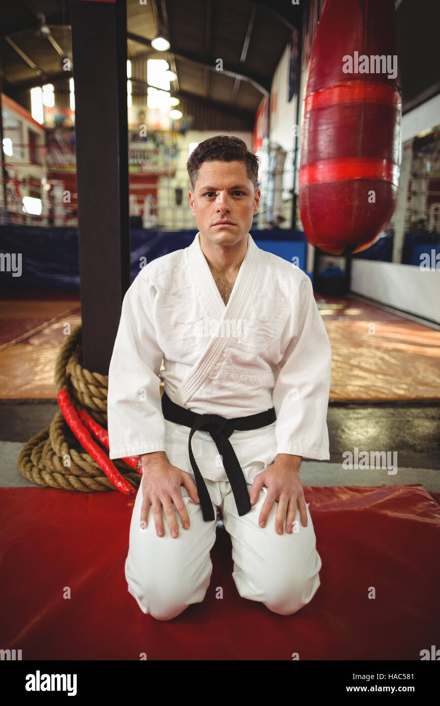 Karate player sitting in seiza position Stock Photo