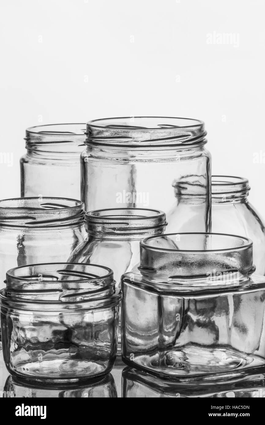 Empty glass jars for preserves, pickles or jam. Stock Photo