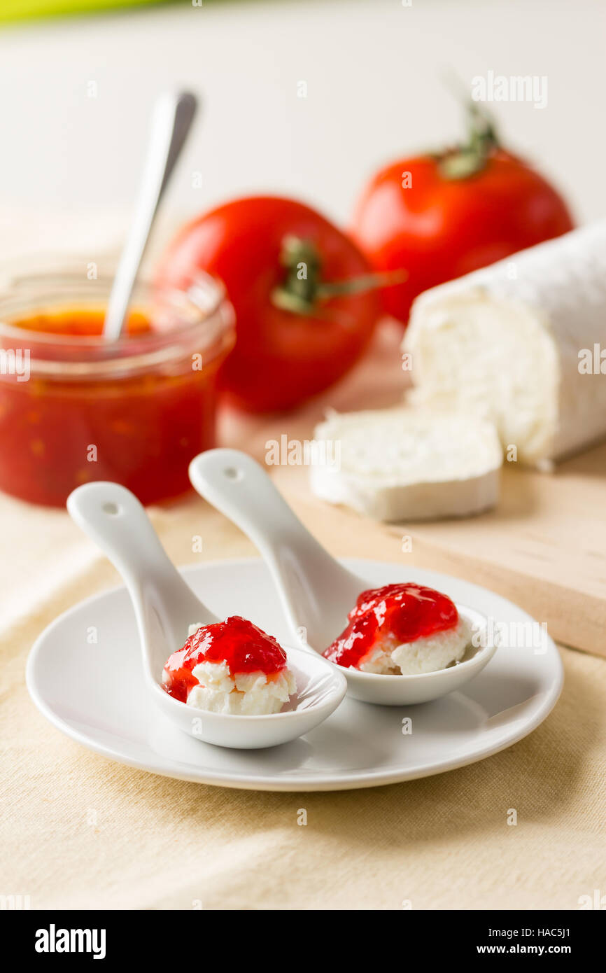 Tomato chutney served on goat cheese Stock Photo