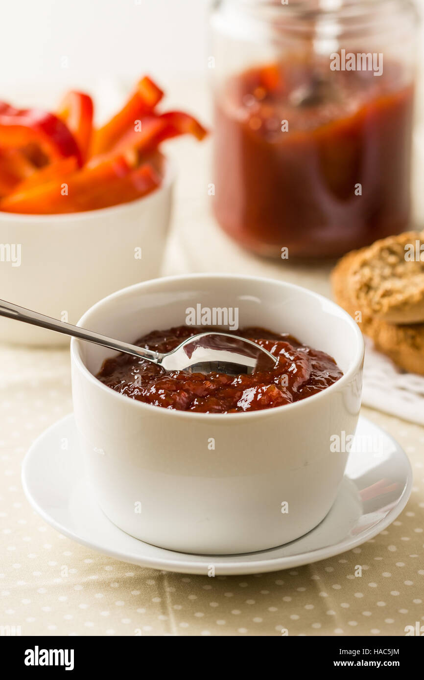 Homemade red bell pepper relish in a bowl Stock Photo