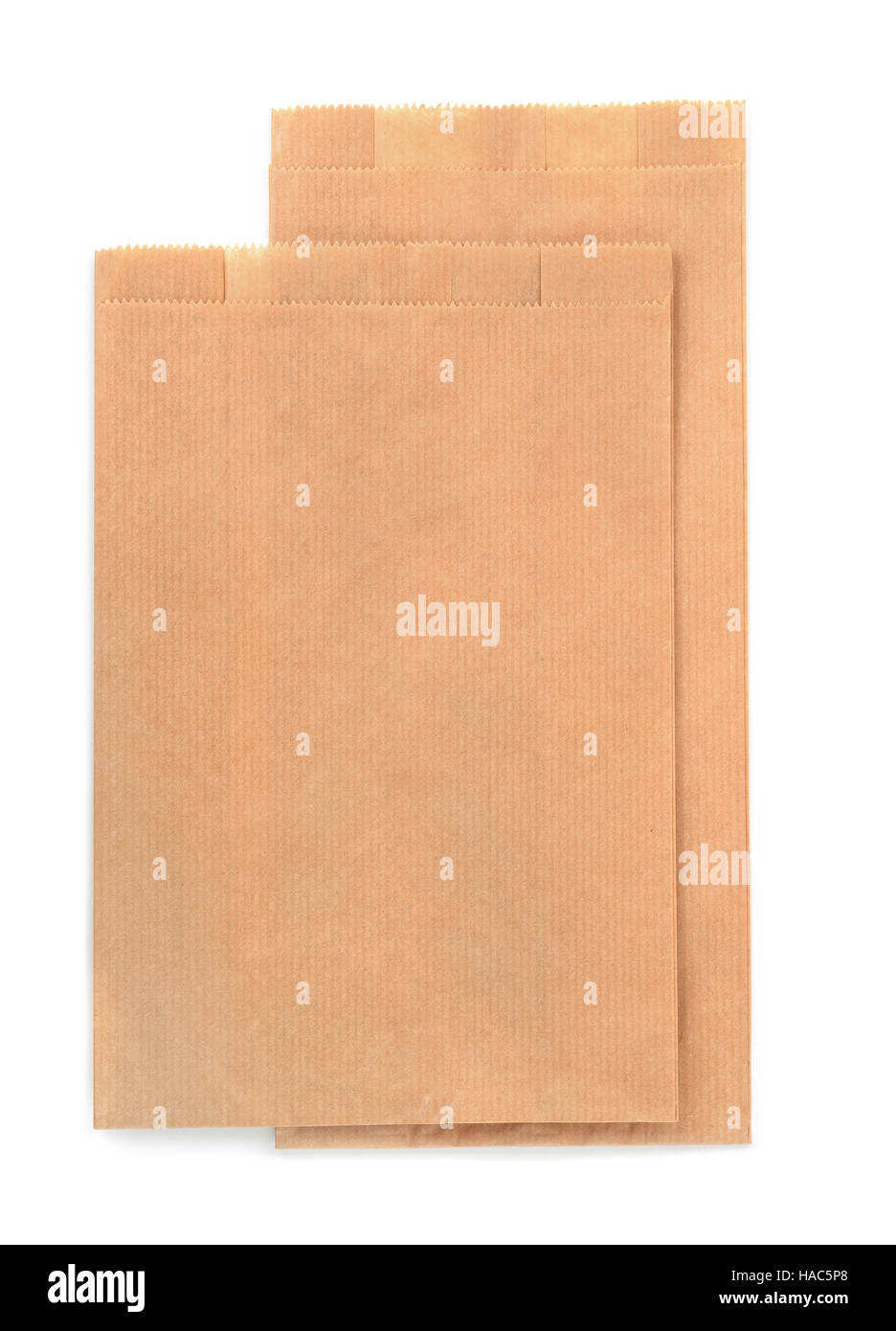 Folded brown kraft paper bags isolated on white Stock Photo