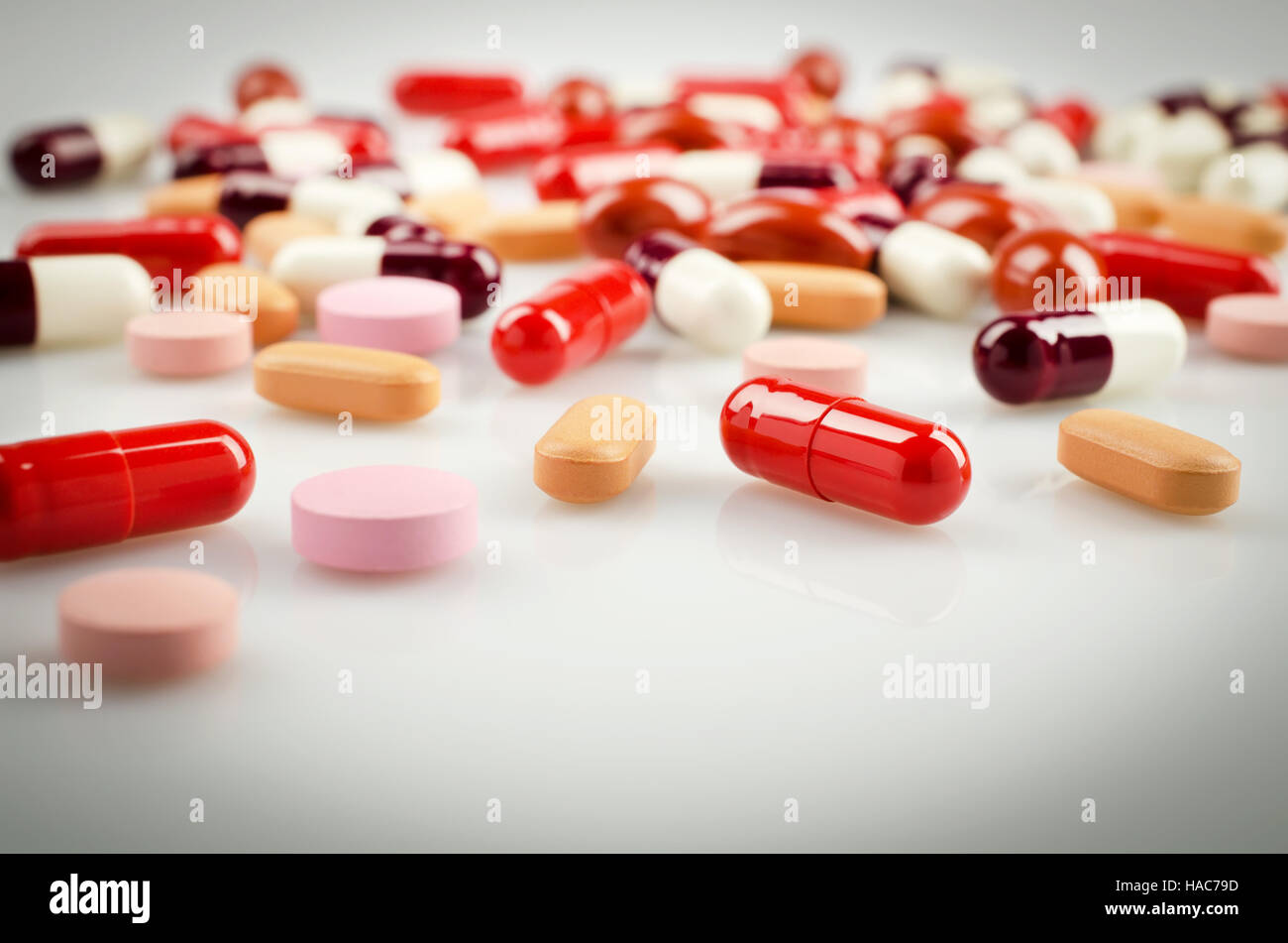 Plenty of Red and other Medical Capsules Stock Photo