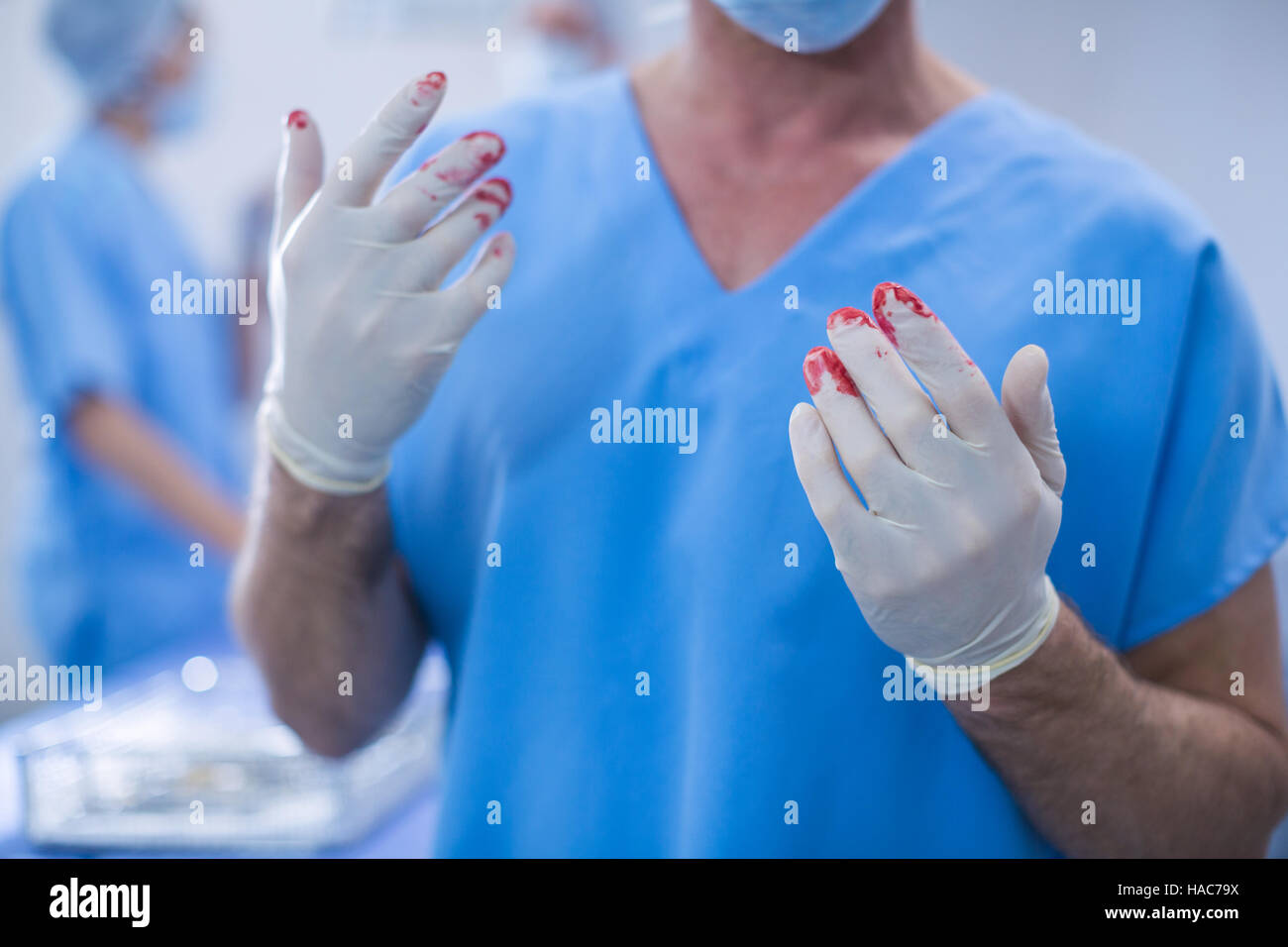 Surgeon with blood on surgical glove in operation room Stock Photo Alamy