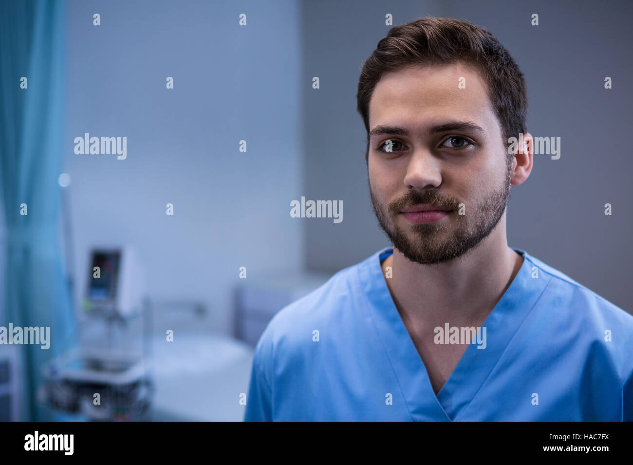 Portrait of surgeon standing in operation room Stock Photo - Alamy