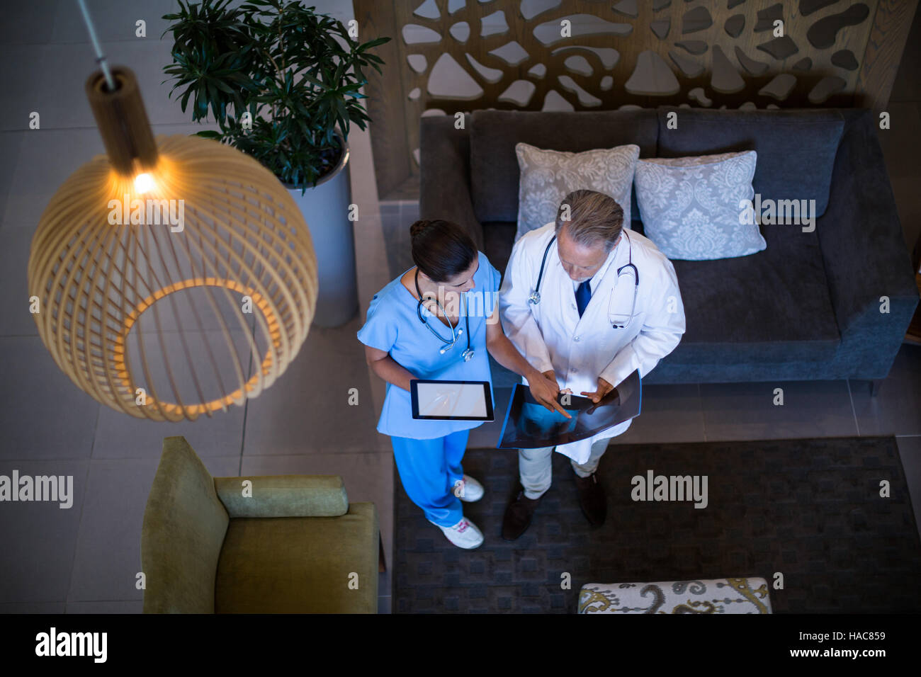 Doctor and nurse discussing over x-ray Stock Photo - Alamy