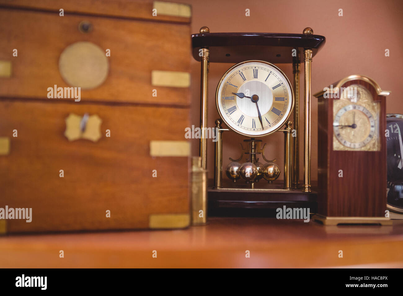Pendulum clock watch on table Stock Photo