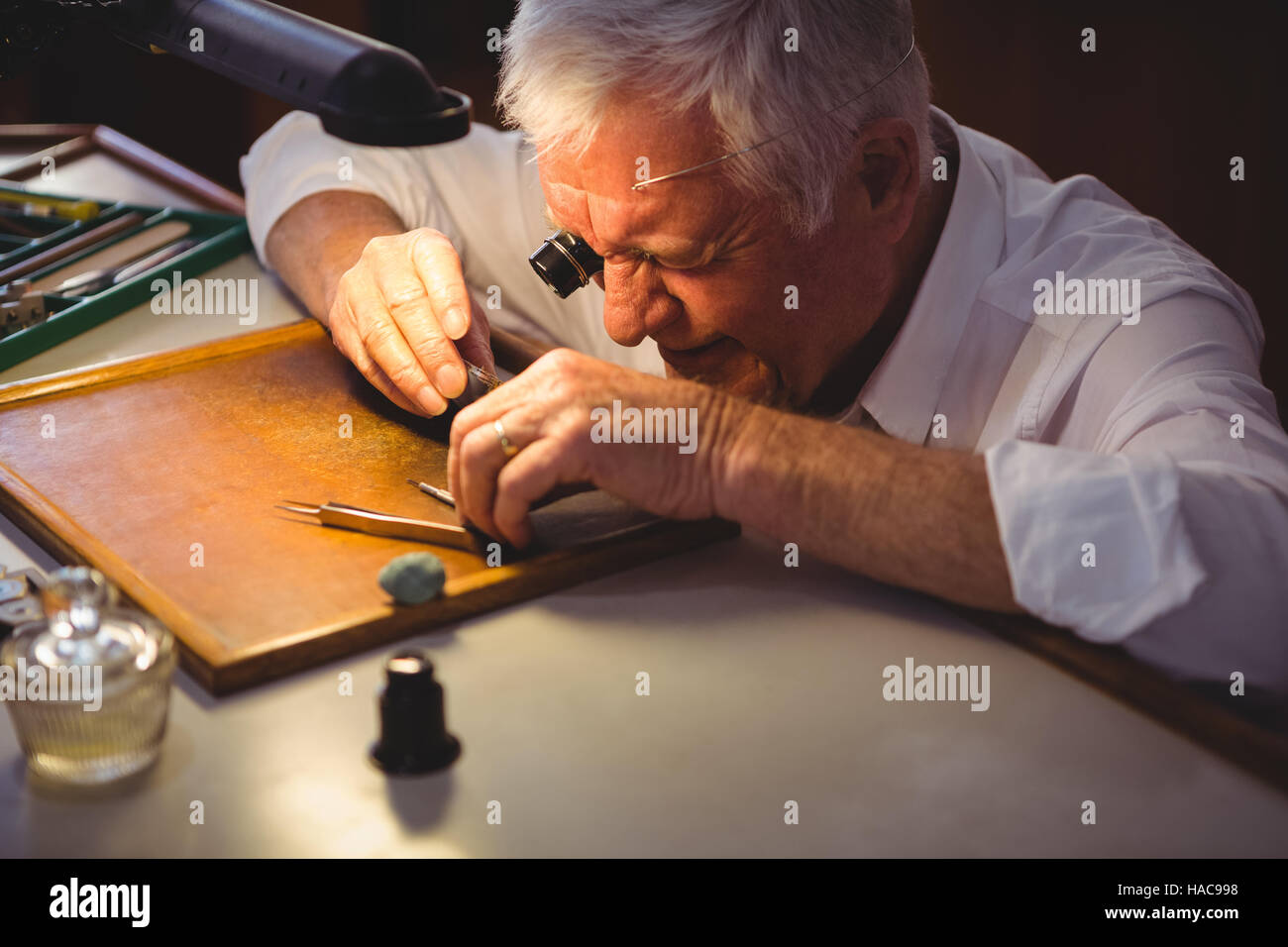 Horologist repairing a watch Stock Photo