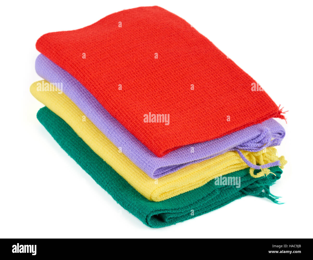 Red, violet, yellow and green scarves isolated on white Stock Photo