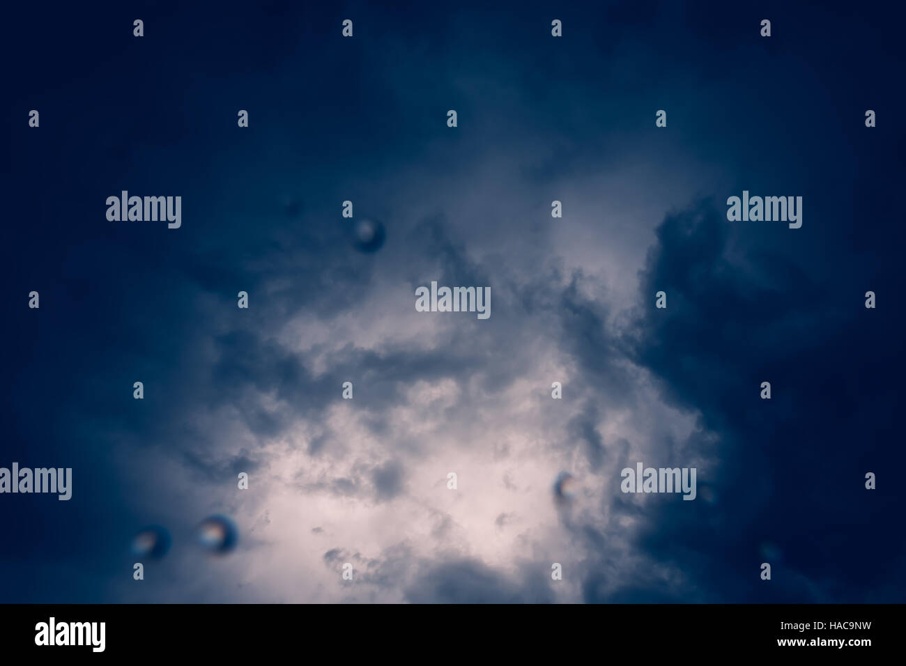 Thunder thunderstorm rain weather climate clouds lens drops sun behind ...