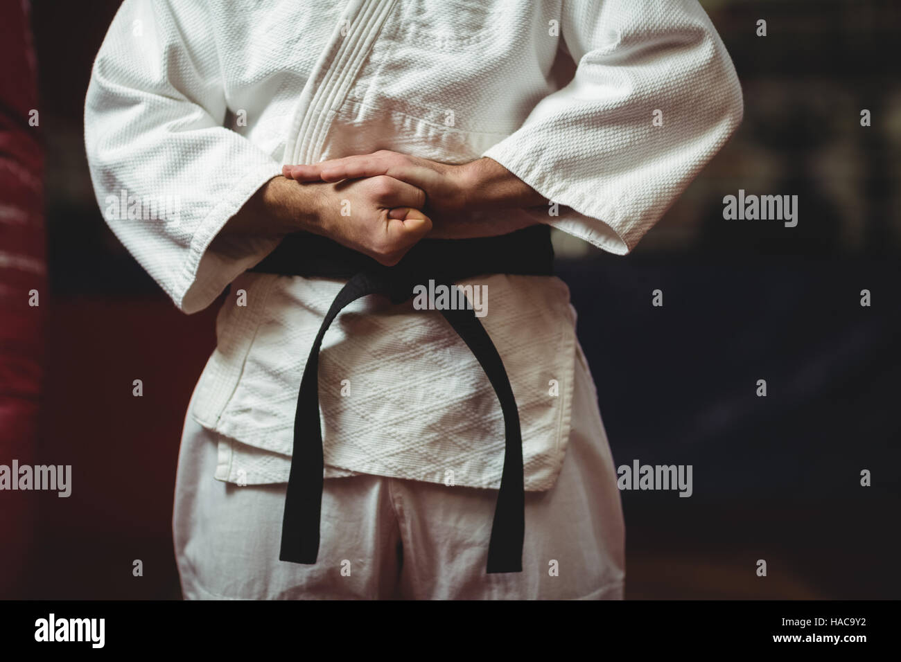 Karate player tying his belt Stock Photo Alamy