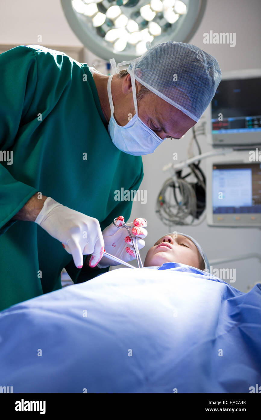 Surgeon operating patient Stock Photo Alamy