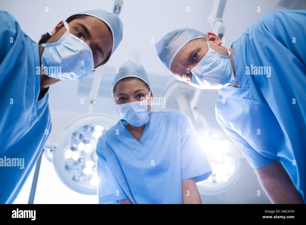 Portrait of surgeons in operation room Stock Photo - Alamy