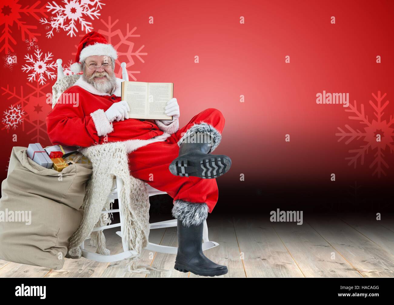 Santa claus sitting on chair and showing bible Stock Photo