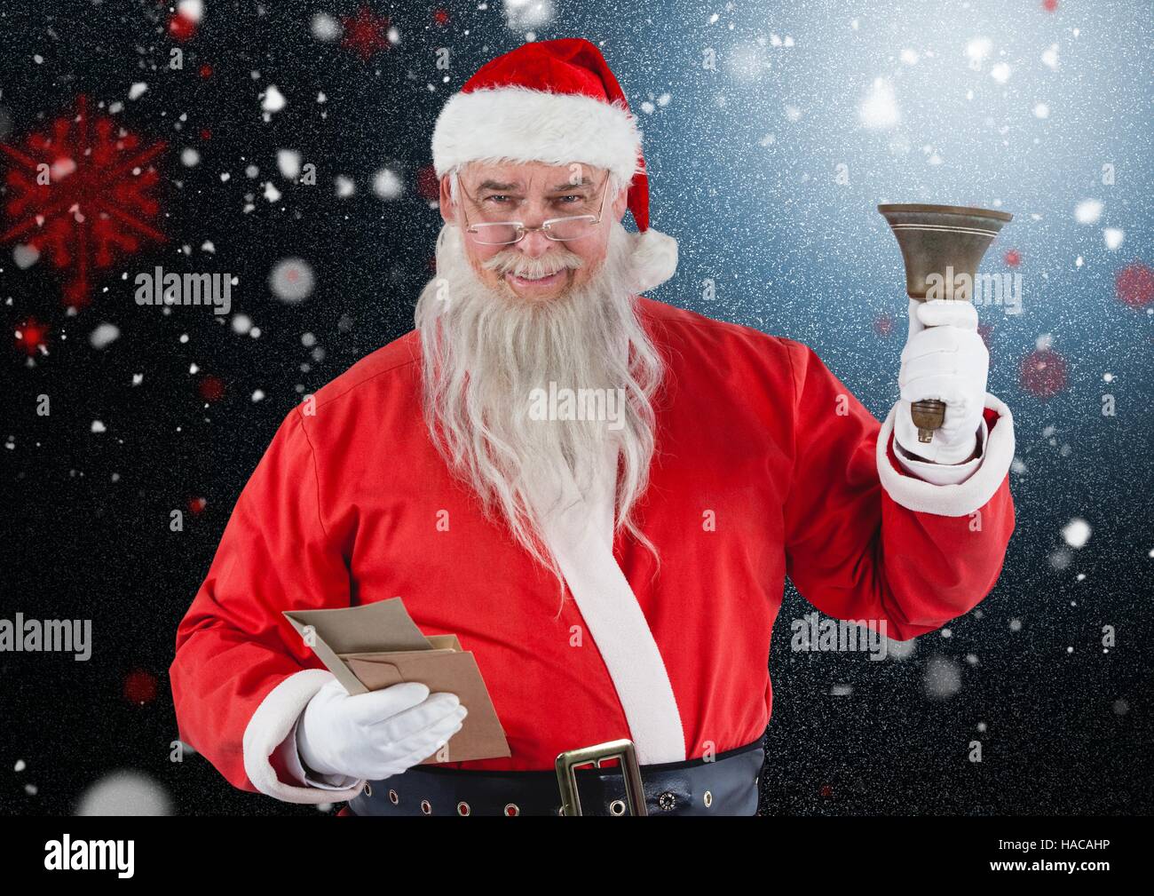 Santa claus holding envelop and christmas bell Stock Photo