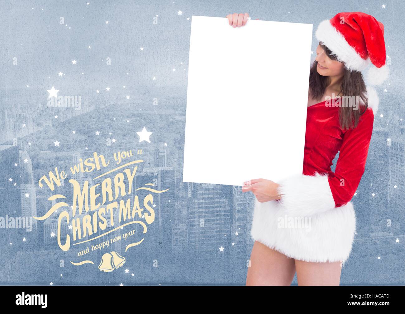 Merry christmas greetings with woman holding blank placard Stock Photo