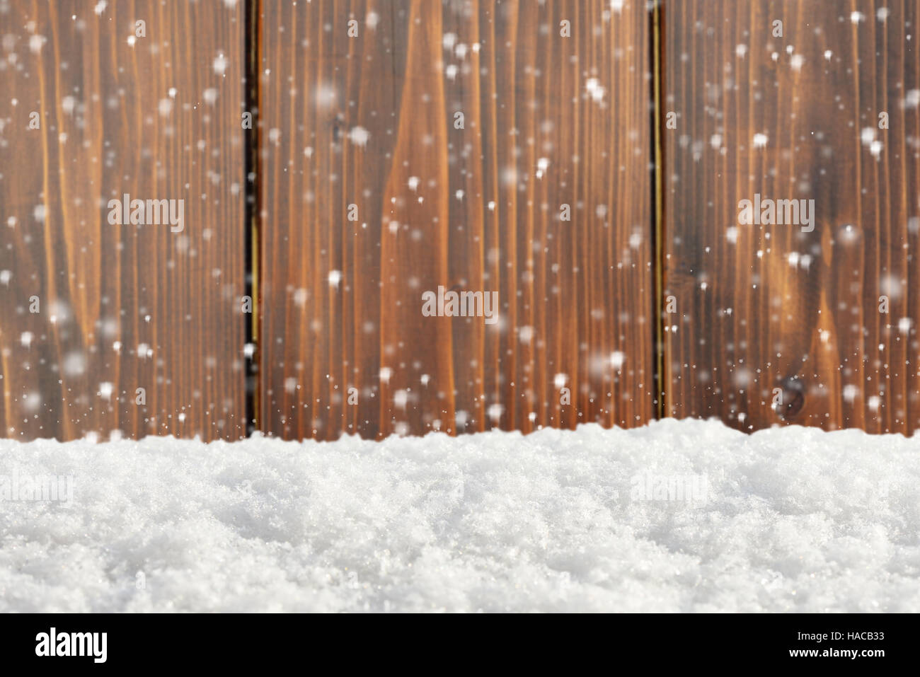 Old wooden background with snowfall and snowdrift Stock Photo