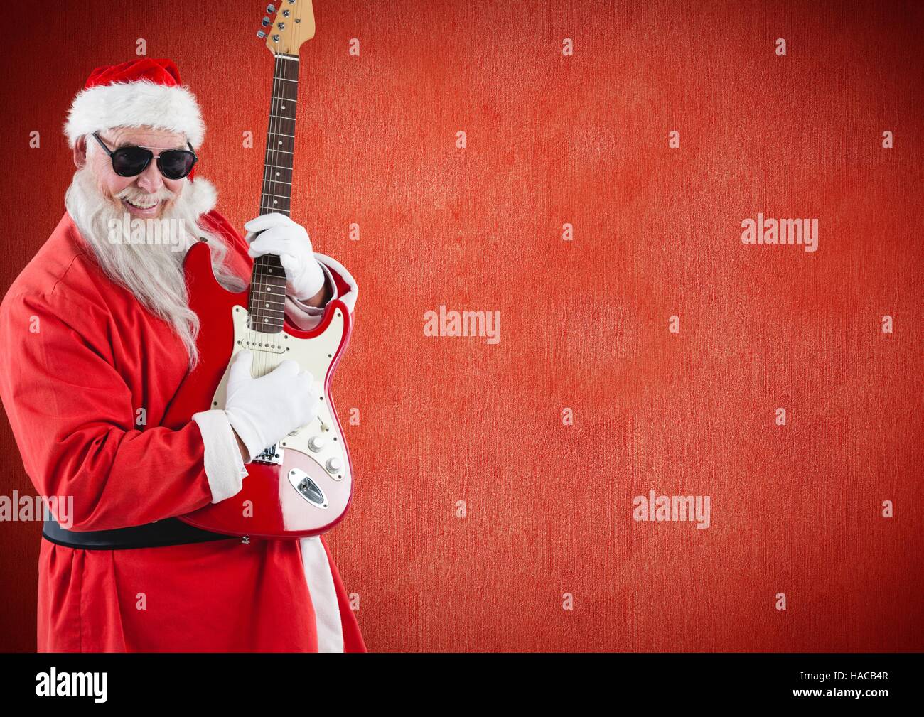 Santa claus playing guitar Stock Photo