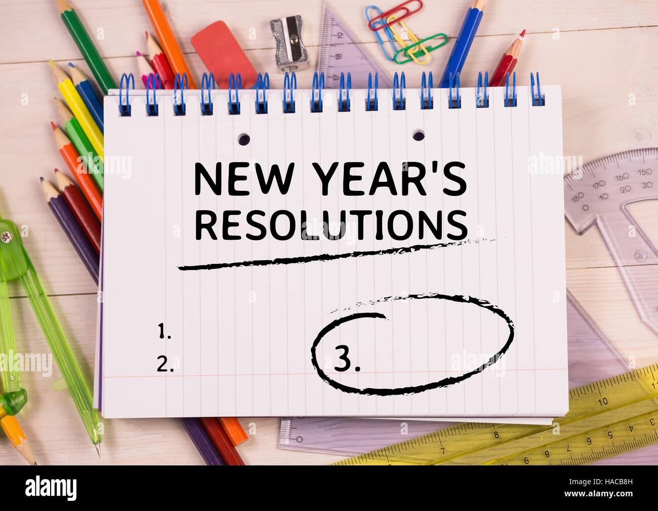 New year resolution goals written on spiral diary Stock Photo