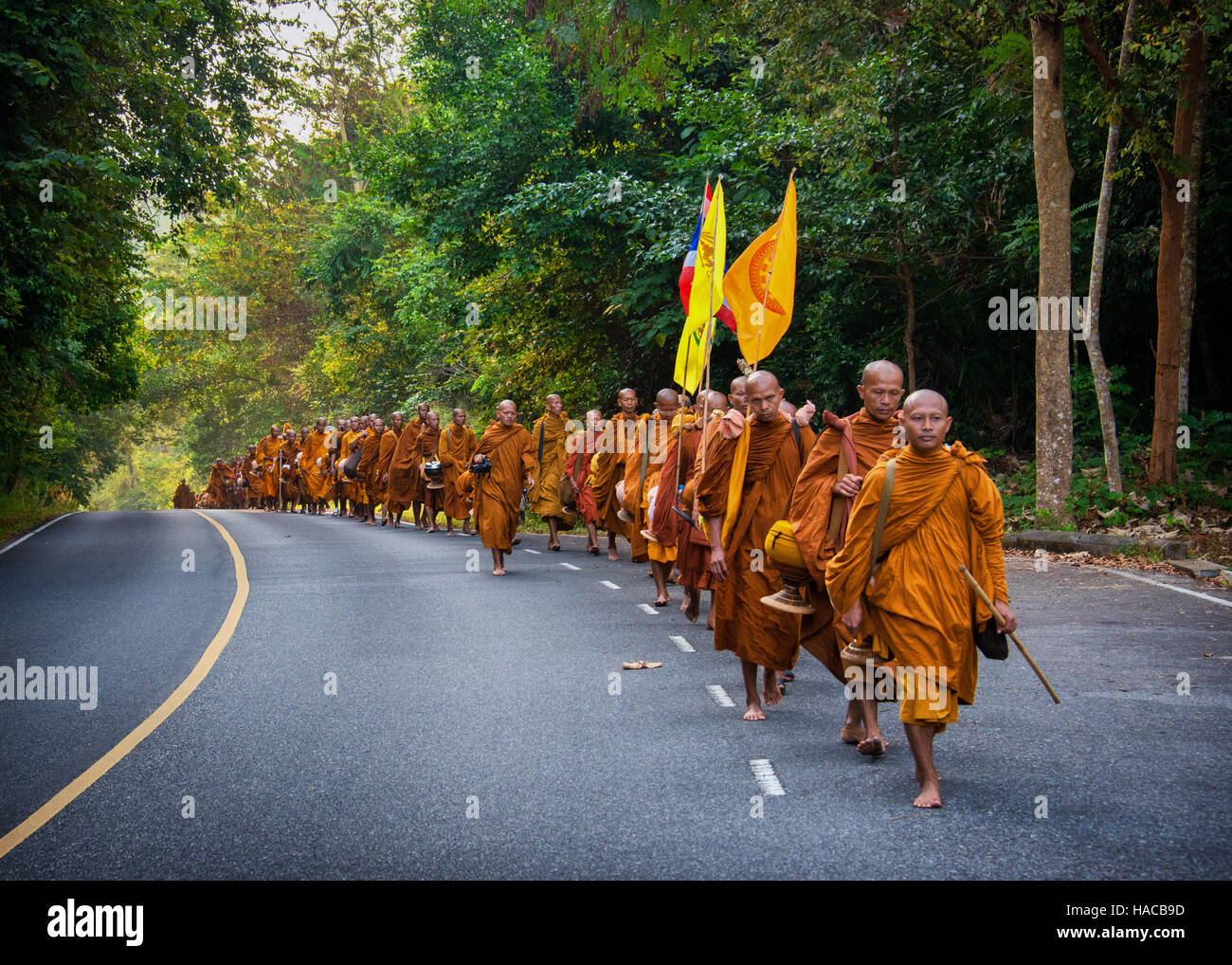100 Monks trek across Thailand barefoot to make merit. Monks from Udon Thani walk across Thailand barefoot once a year to make merit.  Here the monks Stock Photo