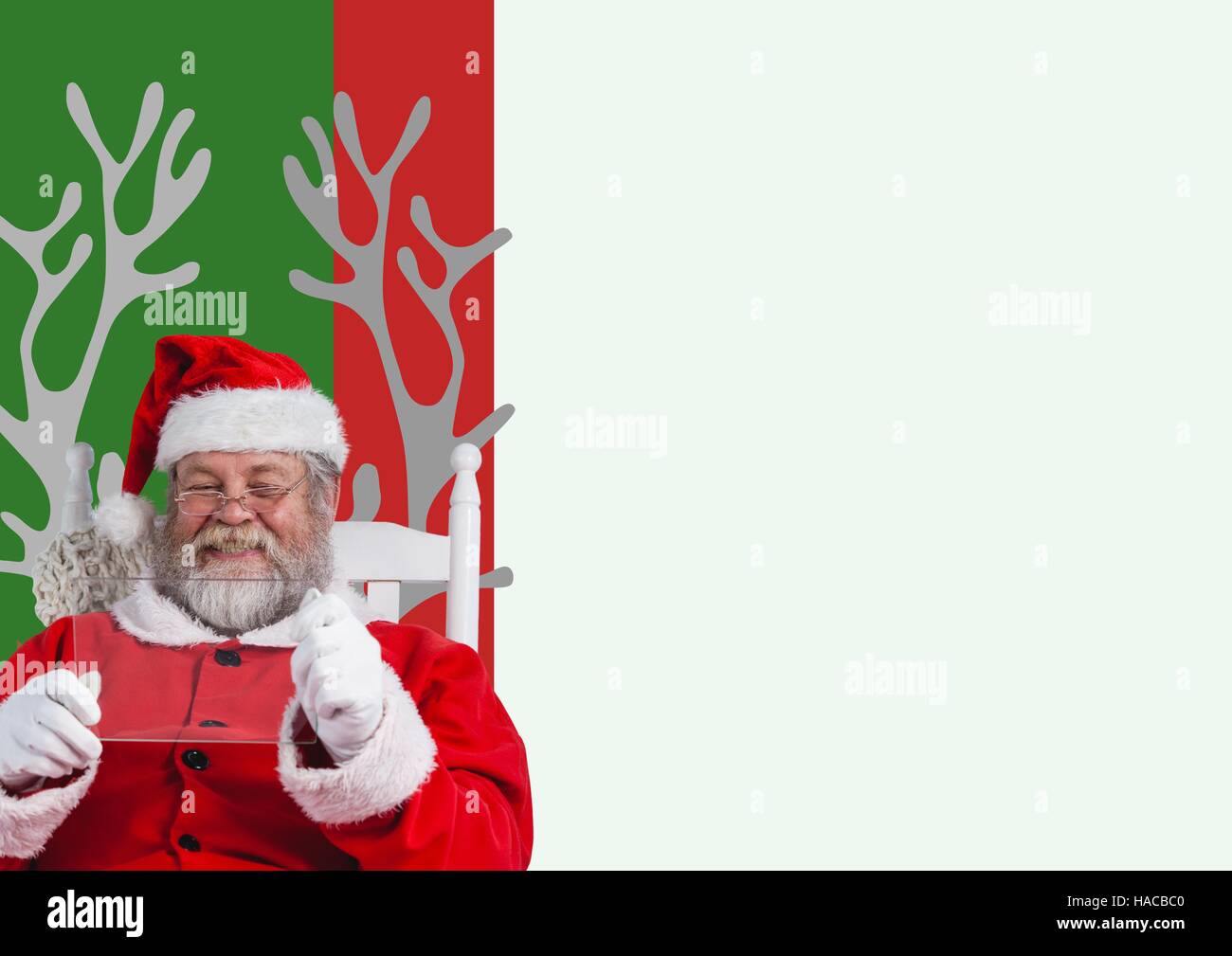 Smiling santa claus holding glass bar Stock Photo
