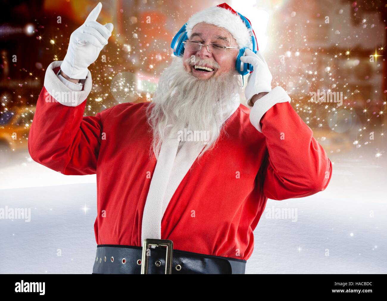 Santa claus listening to music on headphones Stock Photo