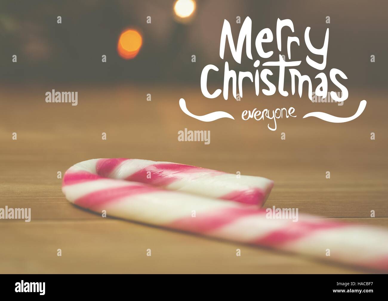 Digitally composite image of merry christmas with candy cane Stock Photo