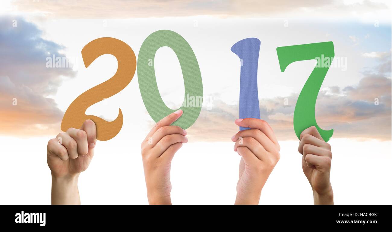 Composite image of hands holding 2017 new year sign Stock Photo