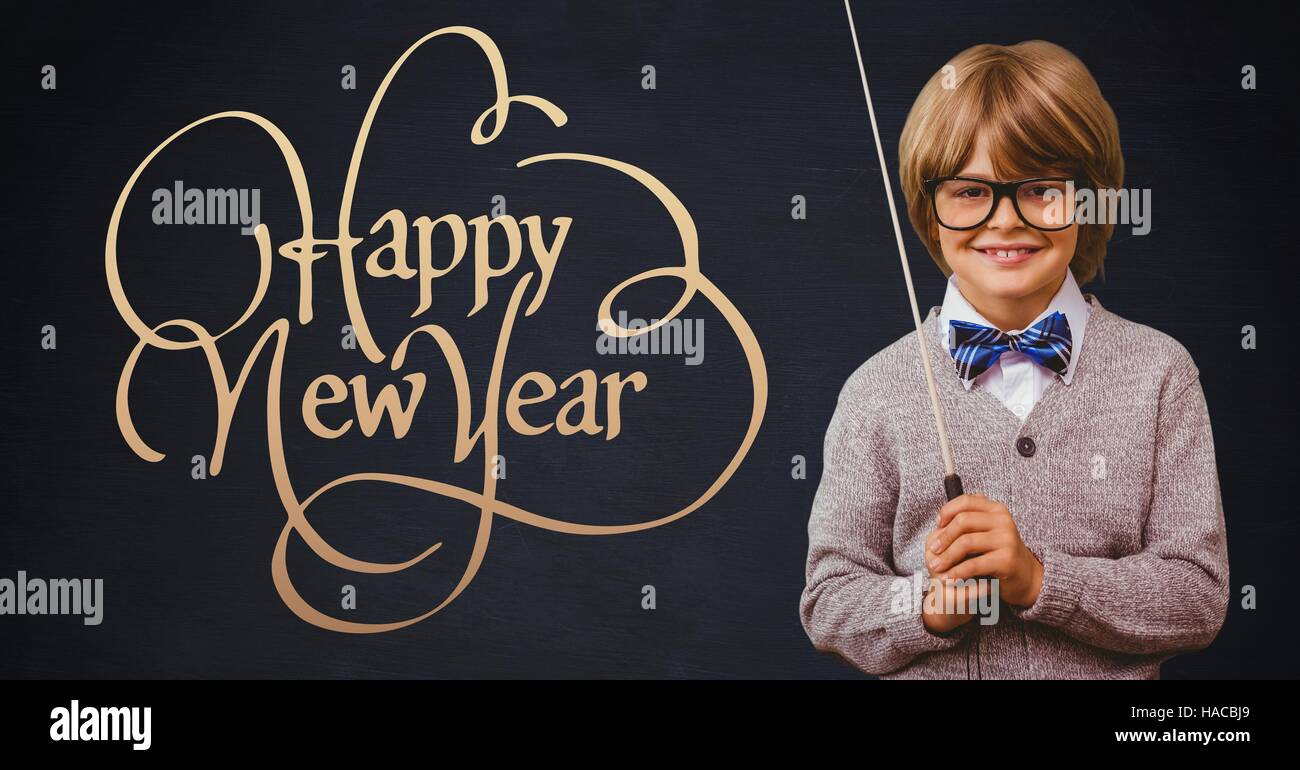 Smiling boy with stick standing next to happy new year wishes Stock ...