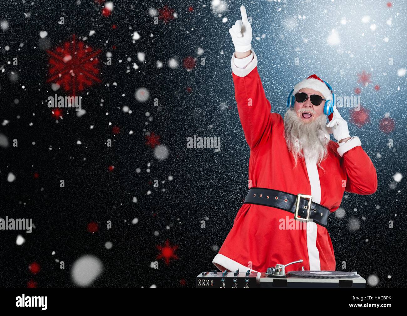 Dj santa claus mixing up some christmas songs Stock Photo