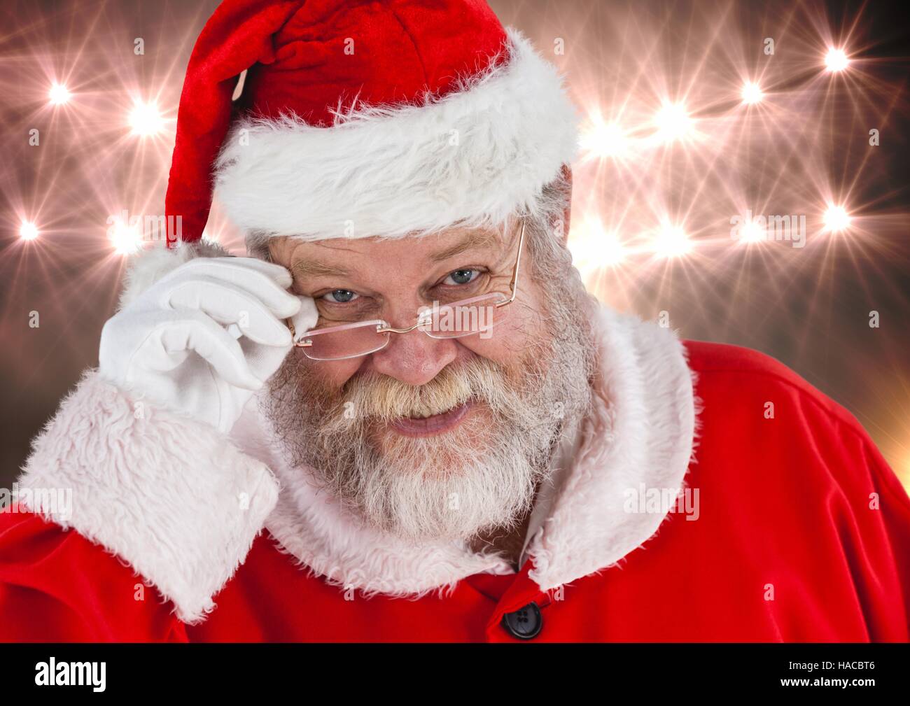 Smiling santa wearing spectacles Stock Photo