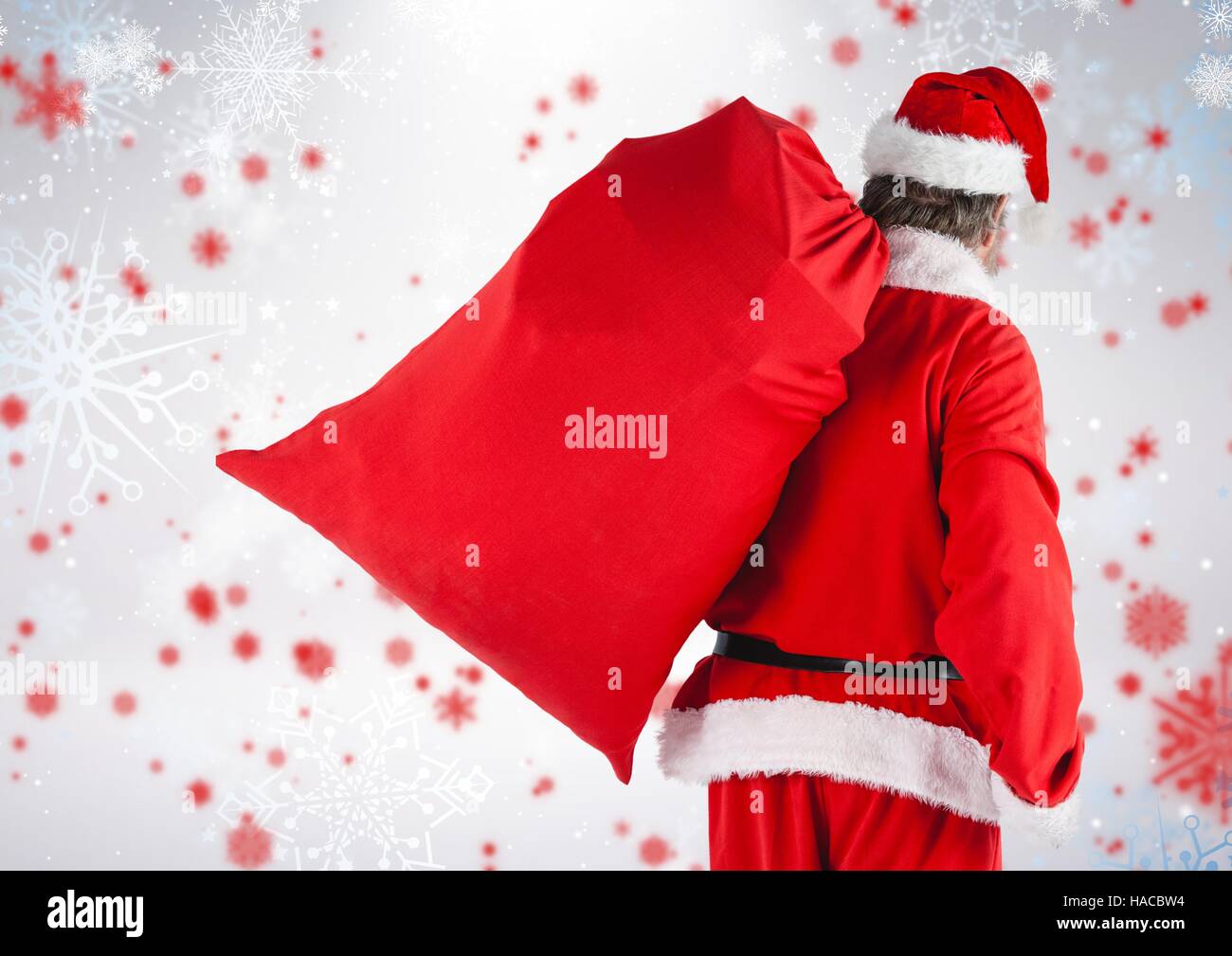 Santa walking with gift sack Stock Photo - Alamy