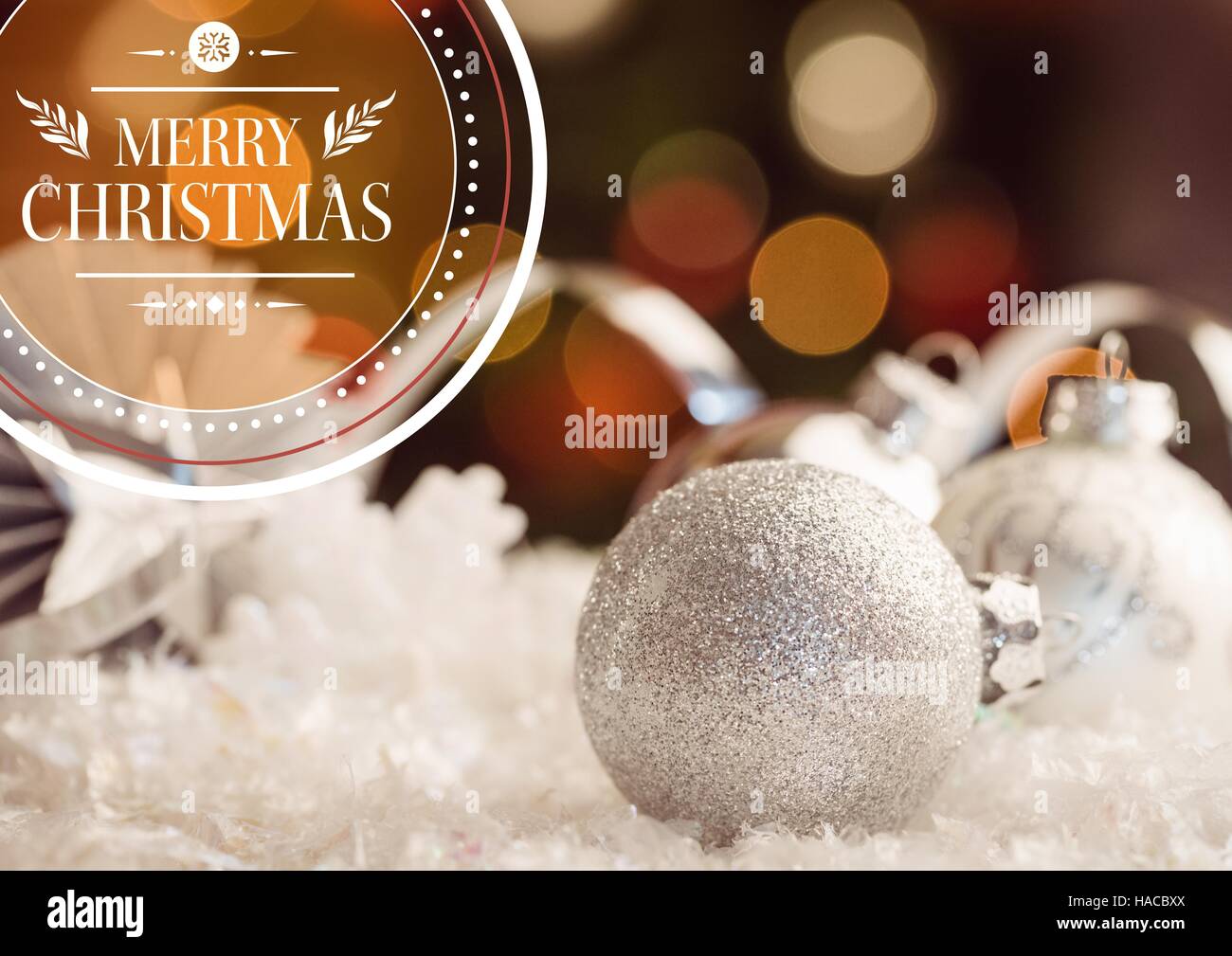 Digitally composite image of merry christmas wishes against baubles decoration Stock Photo