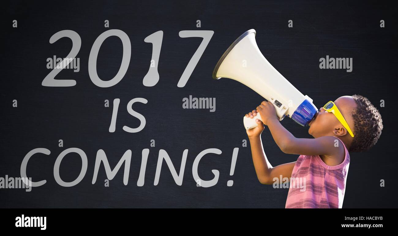 Boy with megaphone against 2017 new year sign Stock Photo