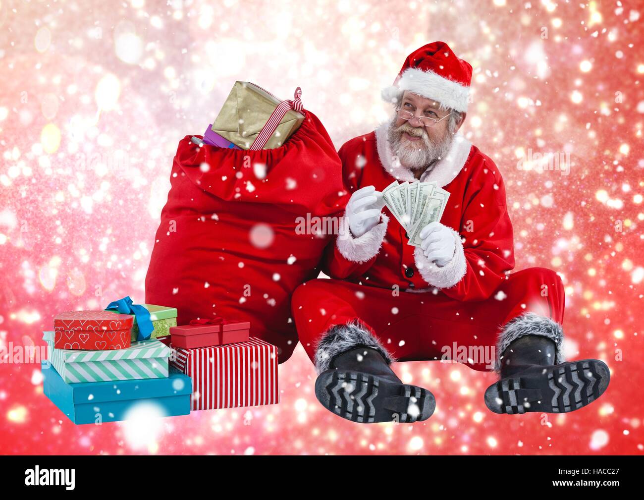 Santa counting money Stock Photo
