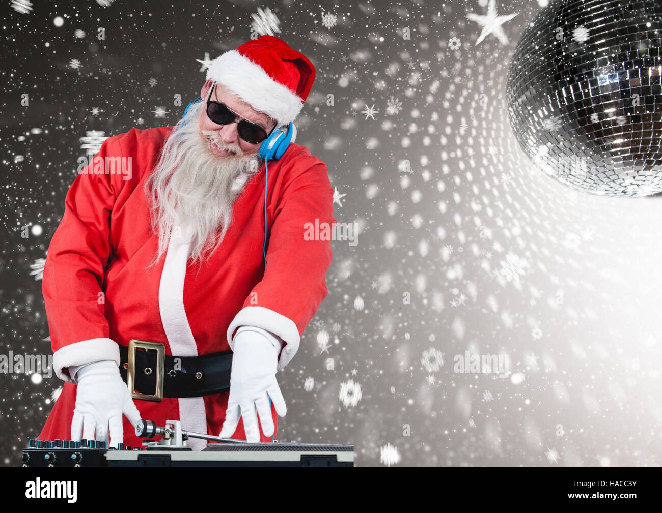 Santa playing dj in disco Stock Photo