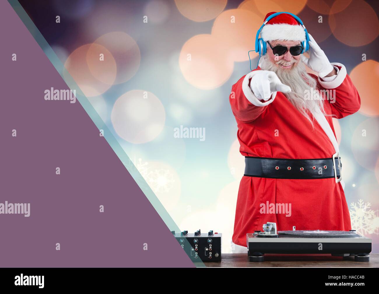 Dj santa mixing up some christmas songs Stock Photo