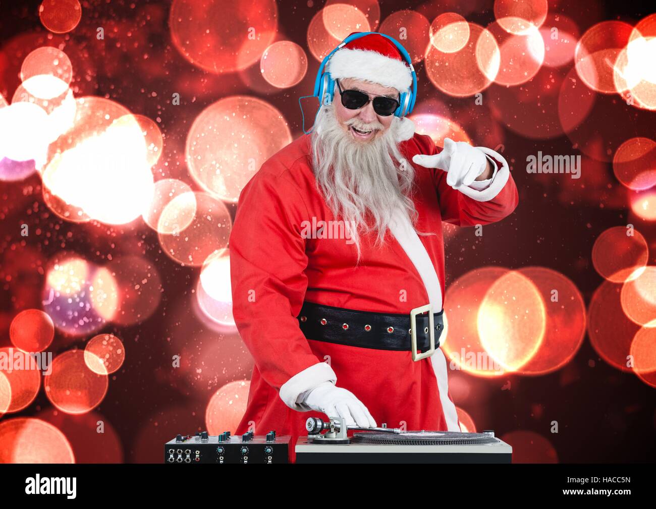 Dj santa mixing up some christmas songs Stock Photo Alamy