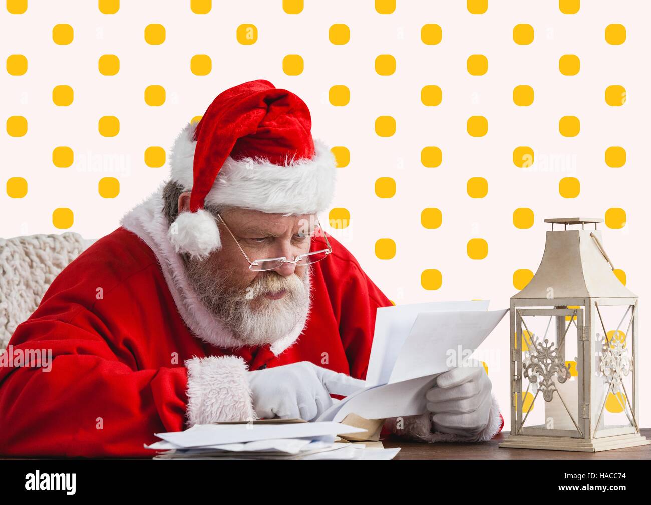 Santa claus reading christmas wish letter Stock Photo