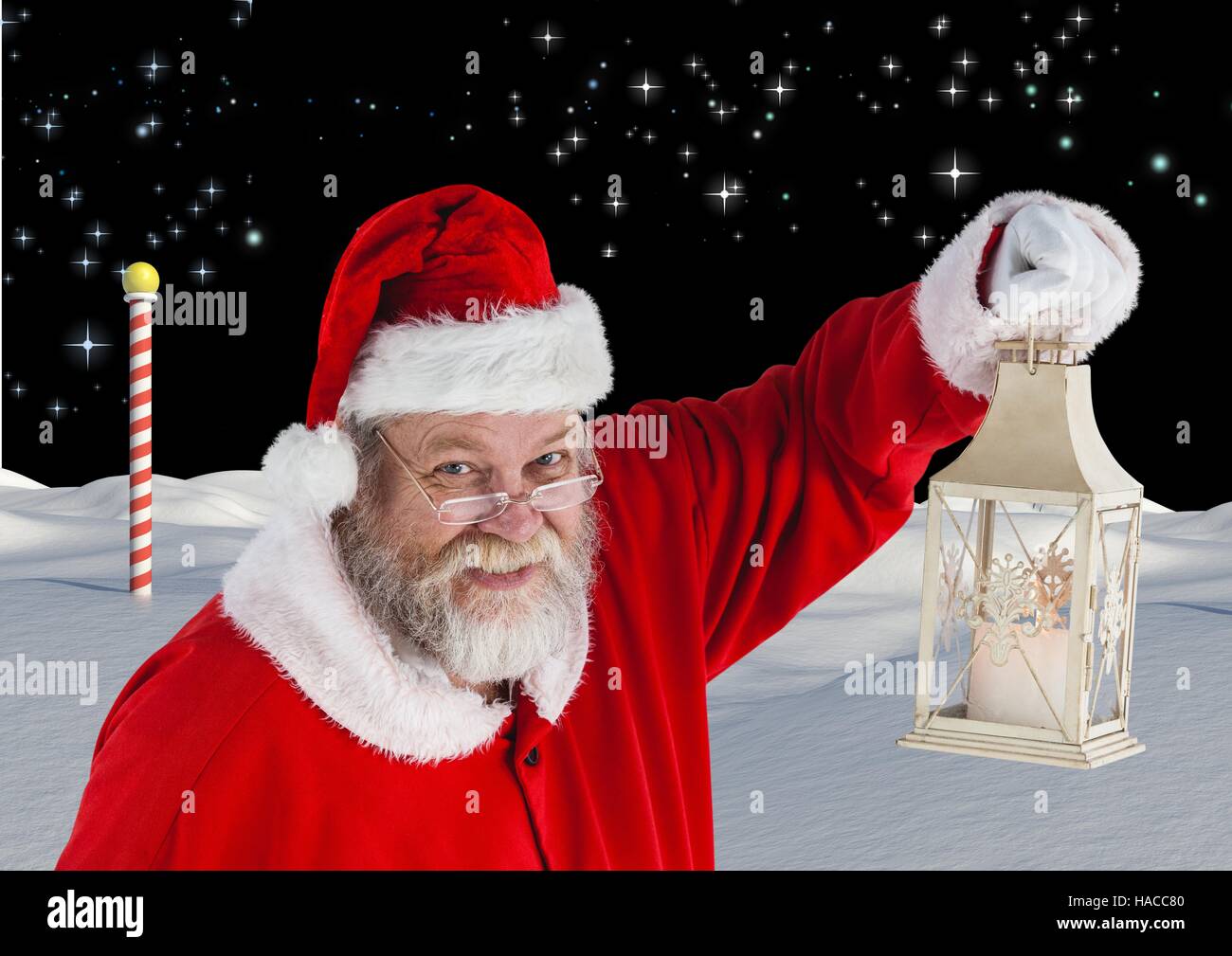 Santa holding christmas lantern Stock Photo